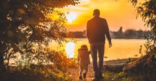 Father and Daughter walk in the light
